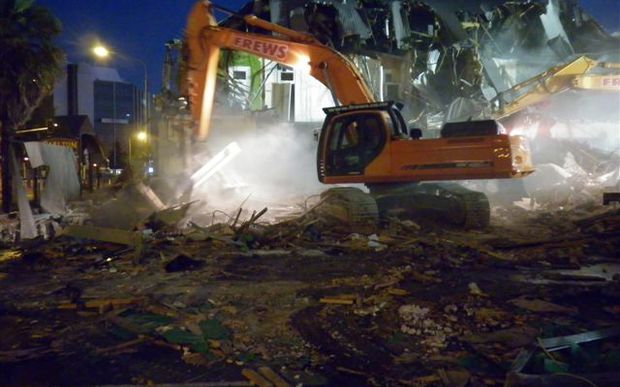 A digger demolishes part of the Carlton Hotel (Tim Graham) 