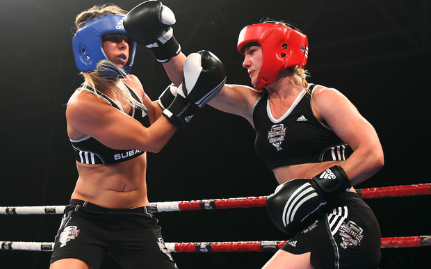Snowboarder Hayley Holt takes on surfer Paige Hareb in a Fight For Life charity boxing event.