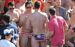 Spectators - reported to be Australian tourists - with swimwear featuring the Malaysian flag during the Formula One Malaysian Grand Prix in Sepang on 2 October.