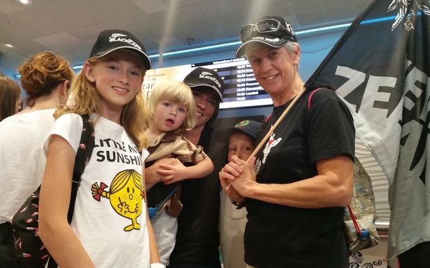 These fans at Auckland International Airport want the Black Caps to know they have done New Zealand proud.