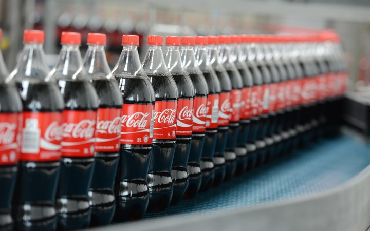 Bottles of Coca-Cola on a production line.