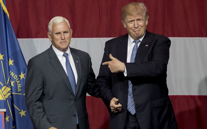 Republican presidential candidate Donald Trump greets Indiana Gov. Mike Pence at the Grand Park Events Center on July 12, 2016 in Westfield, IN.
