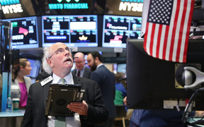 Traders work on the floor of the New York Stock Exchange on 1 November, 2016.