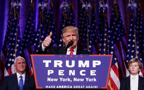 Republican president-elect Donald Trump gives a thumbs up to the crowd during his acceptance speech at his election night event at the New York Hilton Midtown in the early morning hours of November 9, 2016 in New York City. 