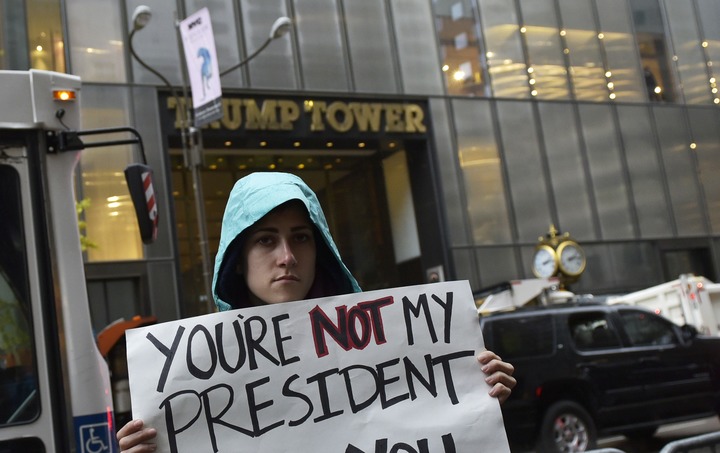 A protester across the street from Trump Tower, on 5th Avenue, New York.