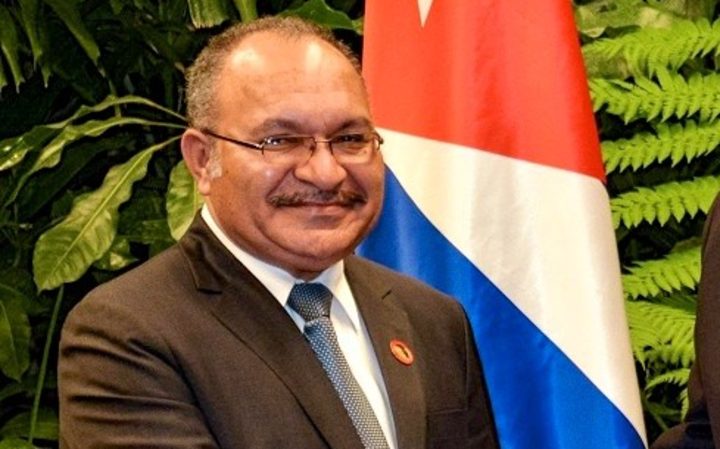 PNG Prime Minister Peter O'Neill (left) extended condolences to Cuba's President Raul Castro (right) on the death of his brother, former Cuban leader Fidel Castro.