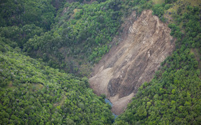 A slip near Goose Bay causing a landslide dam. Water can be seen building at the bottom of frame.