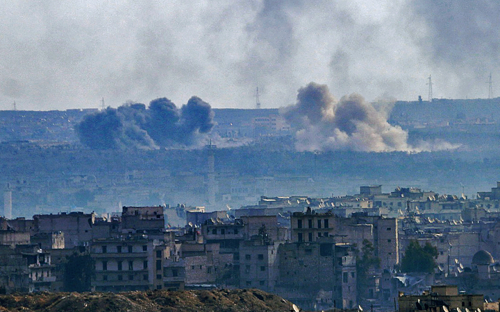 A general view taken from the government-held side of Aleppo shows smoke billowing from the Sheikh Said district during battle between regime forces and rebel fighters on December 3, 2016. 