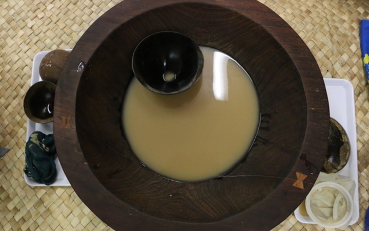 A tanoa (kava bowls) with a bilo (kava cup). Normally the lowliest person would serve kava to the circle. 