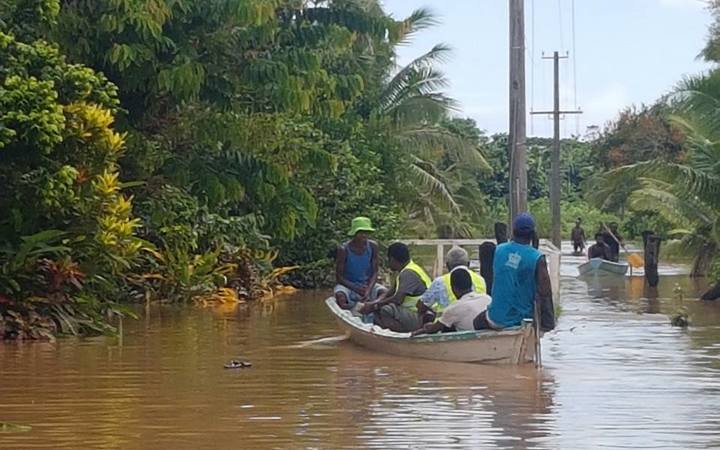 Waivou Village in Rewa Province, Fiji was flooded for a week during floods in December 2016. A Fiji Red Cross team is seen here helping to assess the village's needs.