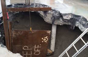 The access hole used to repair the crack in the pipe found by contractors. 