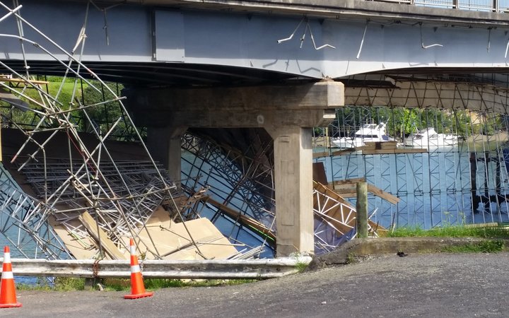 The collapsed scaffolding beneath the bridge.