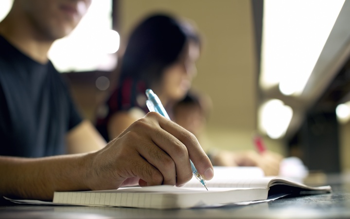 A file photo shows university students studying for an exam