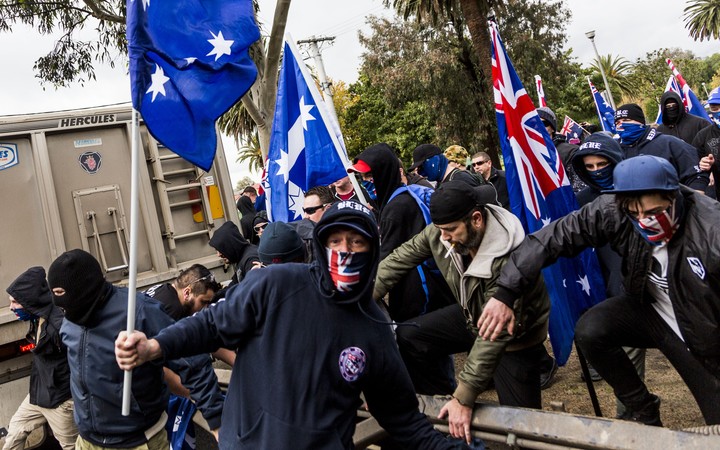 Protestors wear face masks during a 'Say No To Racism' protest in Coburg, Melbourne last year.