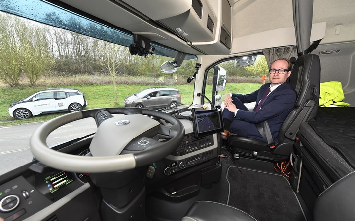 Flemish Minister Ben Weyts poses with a truck at a press meeting on the 'EU Truck Platooning Challenge 2016' involving self-driving trucks which are traveling from Sweden to Rotterdam via Belgium.
