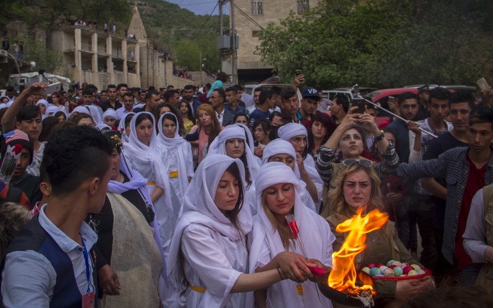 Iraqi Yezidis gather to celebrate Yezidi New Year, known as Chwarshaba Sor or Red Wednesday, in Dohuk on 18 April this year.