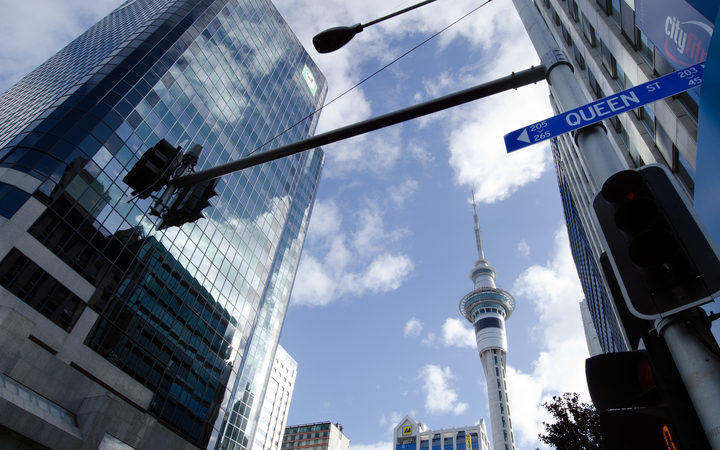 A clear day in Auckland, with the Sky Tower in the background and a Queen St sign in the foreground (file photo) 