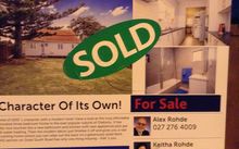 Real estate sold sign