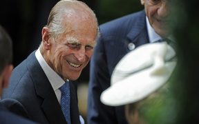 Prince Phillip, the Duke of Edinburgh, is greeted during his visit to the British Garden at Hanover Square in New York, Tuesday, July 6, 2010