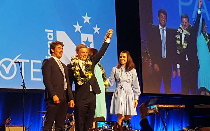 Bill English with his son Xavier, wife Mary (hidden) and daughter Maria.