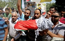 Anger at the funeral of 18-month-old Ali Saad Dawabsha.