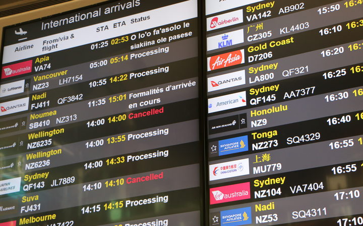 Airport arrivals board showing New Zealand and Pacific countries