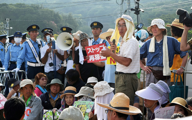 People stage a rally against the restarting of the nuclear reactor in Sendai.