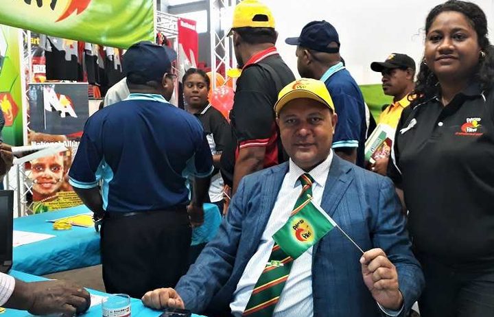 Bulolo MP Sam Basil inside the Pangu Pati's stall at a Political Parties Expo.