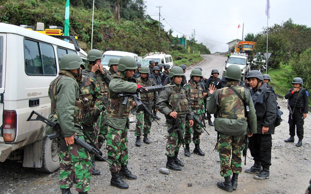 Indonesian soldiers and policemen near Freeport mine