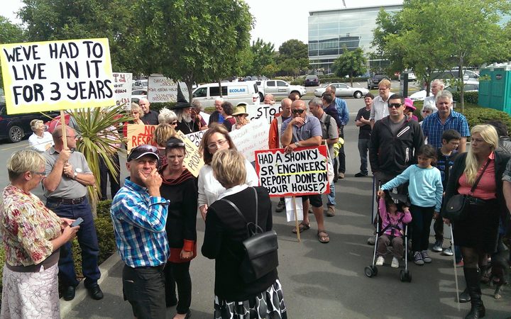 Protestors outside the Southern Response offices.