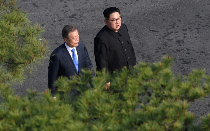 SEOUL; SOUTH KOREA - APRIL 27: South Korean president, Moon Jae-in (L) and North Korean leader Kim Jong-un 