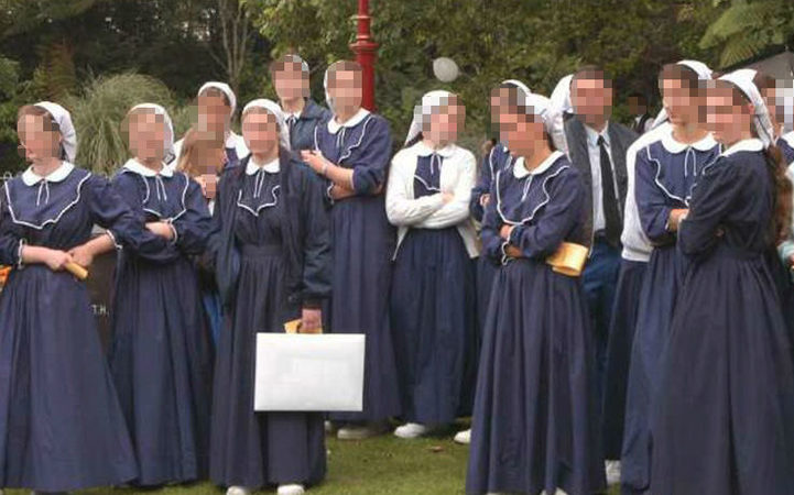 Members of Gloriavale commune at a gathering. Founding member Hopeful Christian stands on the right.