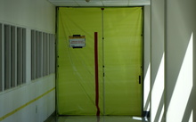 Asbestos warning sign on door