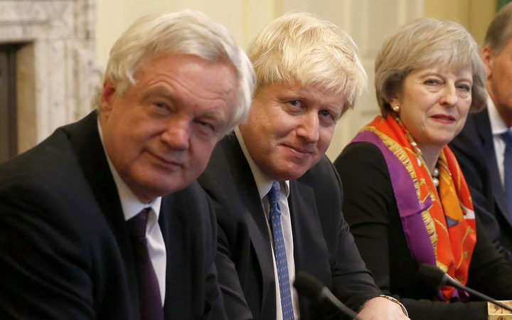 British Prime Minister Theresa May in November 2016 with then-Foreign Secretary Boris Johnson (centre) and Brexit Minister David Davis.