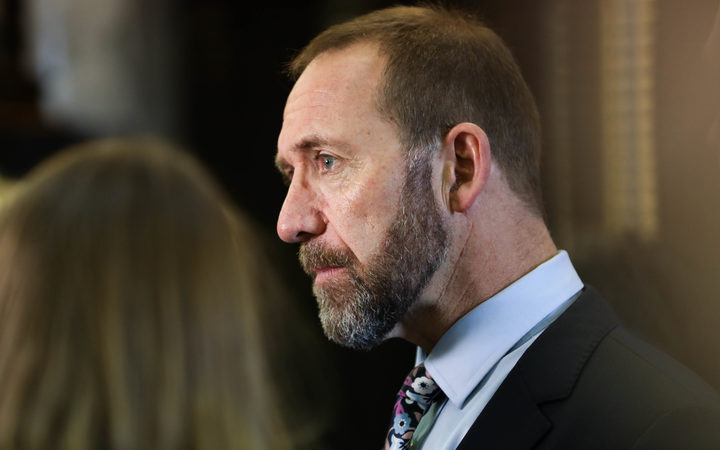 Minister for Justice Andrew Little answers media questions before heading into the debating chamber.