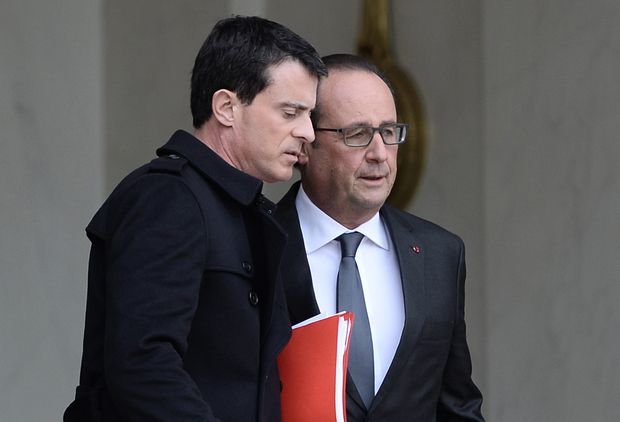 Prime Minister Manuel Valls (left) and President Francois Hollande leave a security meeting on Saturday.