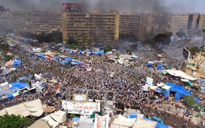 Egyptian security forces intervene civilians at Rabaa al-Adawiya Square where anti-coup demonstrators' held sit-in protests