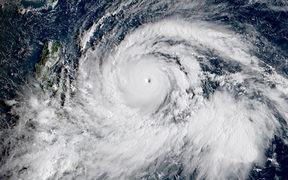 Millions of people are at risk from a strong typhoon set to smash into the northern Philippines this weekend which could bring floods, landslides and huge waves to the disaster-prone nation, rescue workers. 