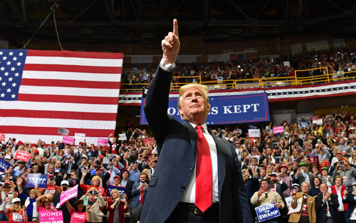 US President Donald Trump arrives for a "Make America Great Again" campaign rally at McKenzie Arena, in Chattanooga, Tennessee on November 4, 2018. (Photo by Nicholas Kamm / AFP)