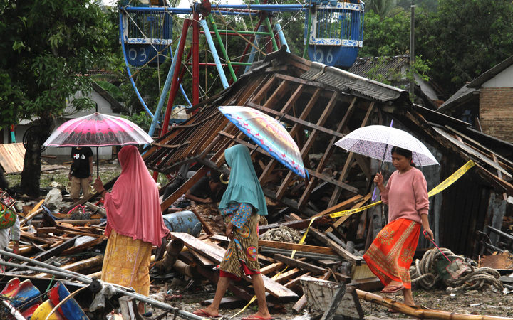 Residents search through debris in Tanjung Lesung, Banten province on December 24.