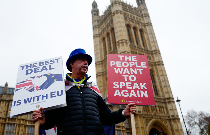 Anti-Brexit activist Steve Bray stands holding placards outside the Houses of Parliament in central London on January 16, 2019. 
