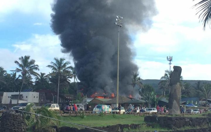 An angry mob torches the courthouse on Rapanui.
