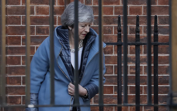 Britain's Prime Minister Theresa May leaves from the rear of 10 Downing Street in London on February 14, 2019 ahead of a vote on amendments to the Brexit withdrawal bill. (Photo by Tolga AKMEN / AFP)