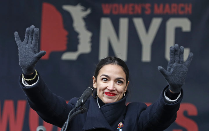 U.S. Rep. Alexandria Ocasio-Cortez, D-New York, waves to the crowd after speaking at Women's Unity Rally organized by Women's March NYC at Foley Square in Lower Manhattan in New York. (AP Photo/Kathy Willens, File)