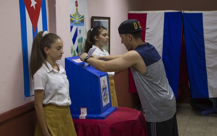 A man casts his vote at a polling station for constitutional referendum in Havana.