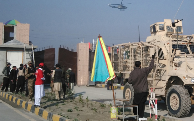 A Pakistani army armoured vehicle (R) enters the Bacha Khan university following an attack by gunmen in Charsadda, about 50 kilometres from Peshawar, on January 20, 2016