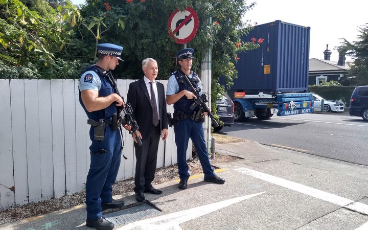 Phil Goff with armed police officers at Otahuhu.