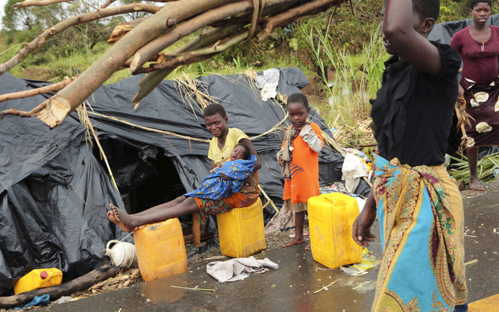 Survivors of Cyclone Idai in a makeshift shelter by the roadside near Nhamatanda about 50 kilometres from Beira, in Mozambique, 