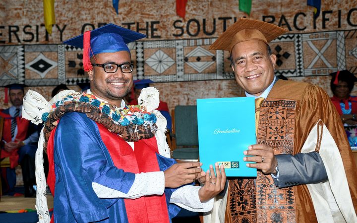 PhD in Climate Change graduate, Jale Samuwai, is conferred with the award by the H.E Taneti Maamau, Chancellor of USP