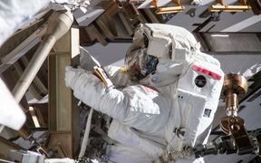 Astronaut Anne McClain working on the International Space Station's Port-4 truss structure during a six-hour, 39-minute spacewalk to upgrade the orbital complex's power storage capacity. 